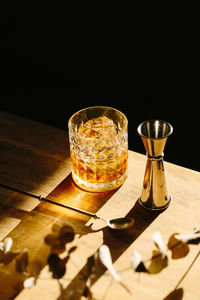 Close-up of glass with bourbon whiskey on table