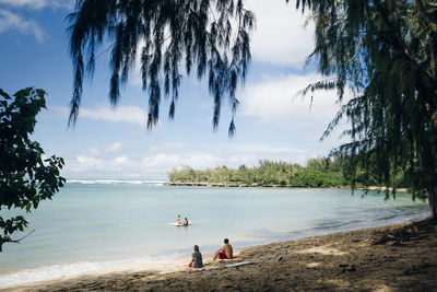 Rear view of woman walking on beach