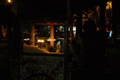 Man in illuminated city at night