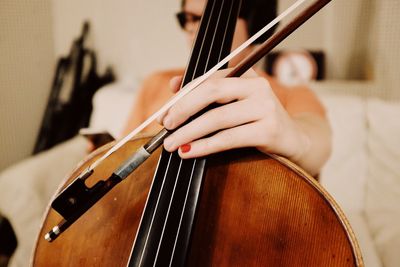 Close-up of hands playing piano