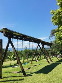 Trees on field against clear sky