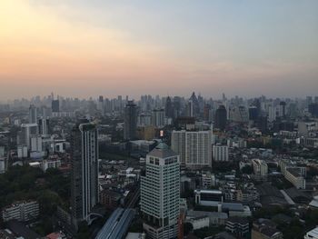 High angle view of modern buildings in city against sky