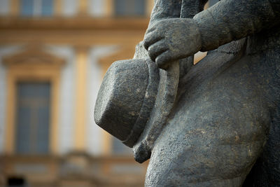 Stone hat held by hand.