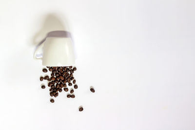 Close-up of coffee cup over white background