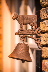 Texel, the netherlands. august 13, 2021. close up of a rusty bell with image of cow.