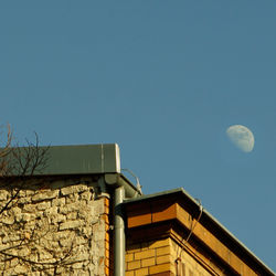 Low angle view of building against blue sky