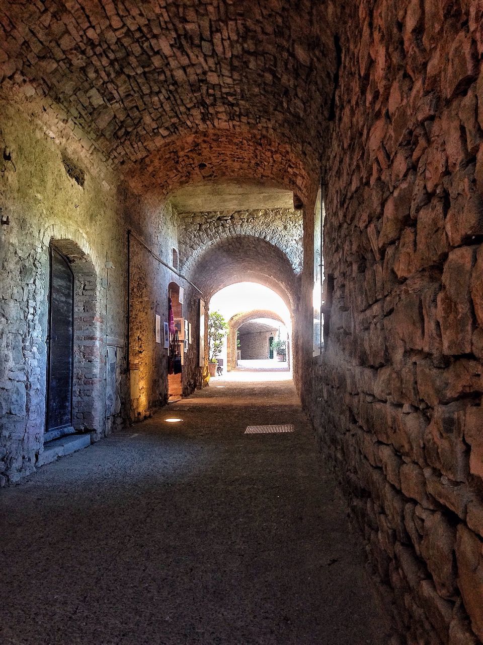 architecture, arch, built structure, indoors, the way forward, archway, corridor, diminishing perspective, history, old, stone wall, window, empty, day, tunnel, building exterior, arched, building, narrow, vanishing point