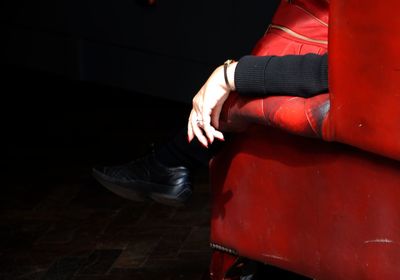 Low section of woman sitting on floor