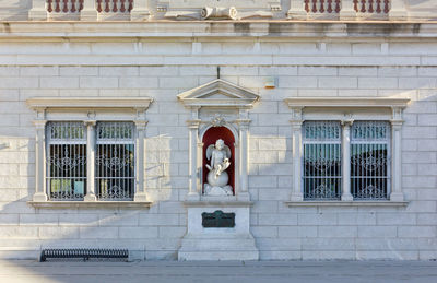 Low angle view of statue against building