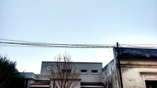 Low angle view of buildings against blue sky