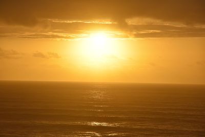 Scenic view of sea against sky at sunset