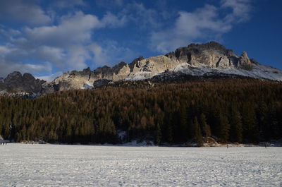 Scenic view of mountains against sky during winter