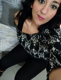 Portrait of beautiful woman sitting at home