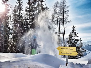 Information sign on snow covered land