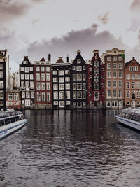 View of buildings against cloudy sky