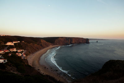 Scenic view of sea against clear sky during sunset