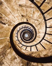 Directly below shot of spiral staircase of building