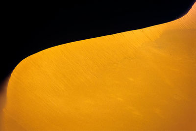 Idyllic shot of sand dune in desert during sunset