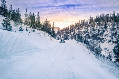 Snow groomer on snow field