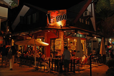 Group of people in restaurant at night