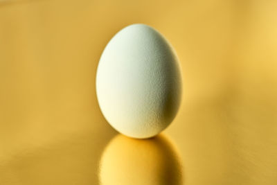 Close-up of apple against yellow background