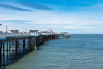 Pier over sea against sky