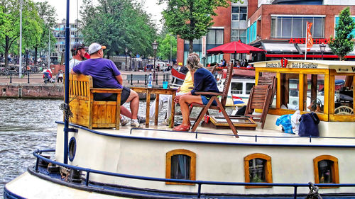 Boating in river against built structures