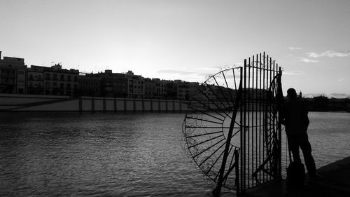 River in city against sky