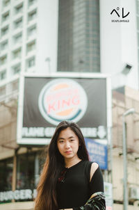 Portrait of beautiful woman in city