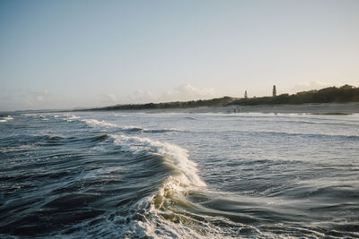 Scenic view of sea against clear sky during sunset