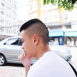 Portrait of man looking away in car