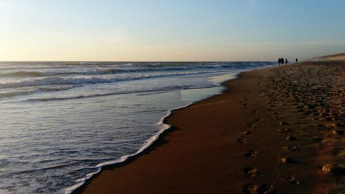 Scenic view of beach against clear sky