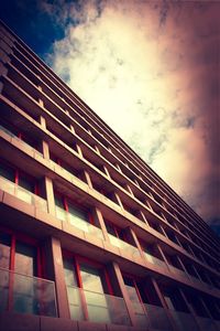 Low angle view of building against cloudy sky