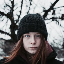 Close-up portrait of teenage girl in snow
