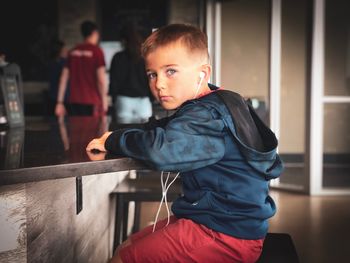 Portrait of boy listening to music