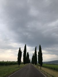 Empty road along countryside landscape