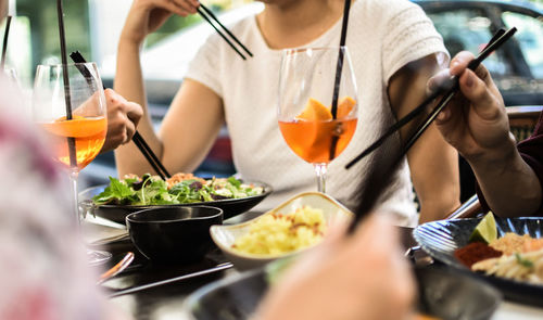 Midsection of woman holding food