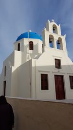 Low angle view of white building against blue sky