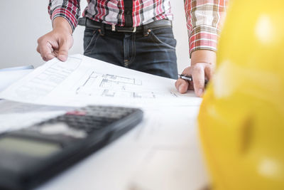Low section of people working on table