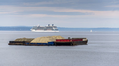 Ship sailing on sea against sky