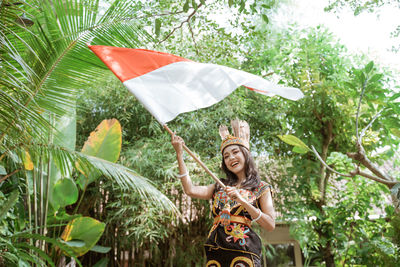 Portrait of woman holding umbrella