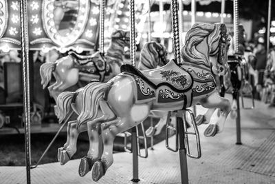 Carousel horses in amusement park