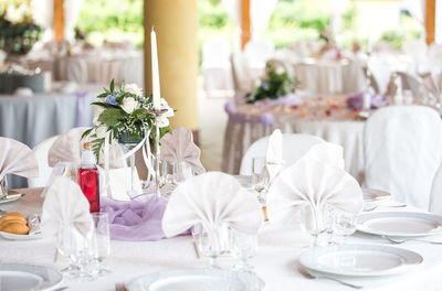 Close-up of decorated dining table at wedding