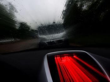 Close-up of road seen through car window