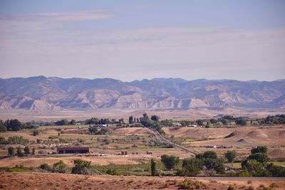 Scenic view of landscape and mountains against sky