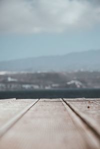 Surface level of pier against sky