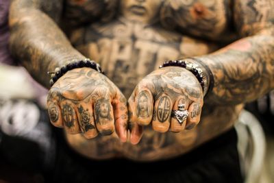 Cropped image of man with tattoo
