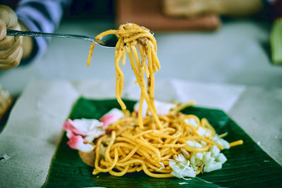 Close-up of fresh yellow flowers in plate on table