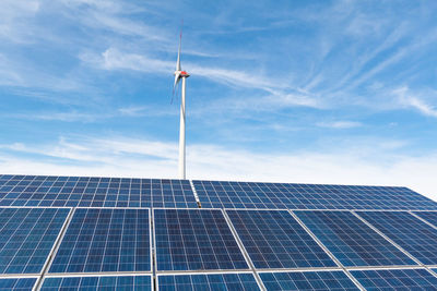 Low angle view of solar panels against sky