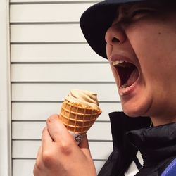 Close-up of man eating ice cream